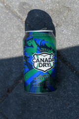 Obraz premium discarded Canada Dry limited-edition Toronto Blue Jays collectible cans on the pavement downtown Toronto