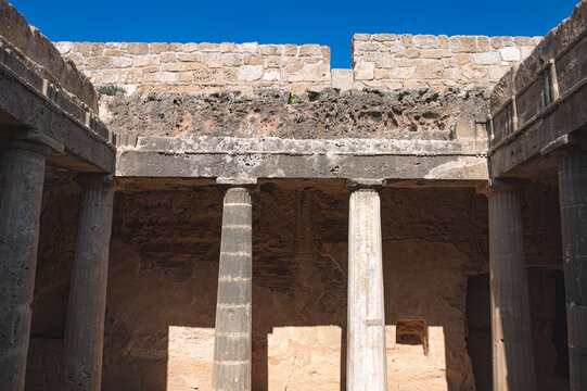 Ancient stone pillars of Tombs of the Kings in the ancient archaeological site in Paphos, Cyprus