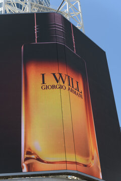 large-format digital out of home spectacular billboard with advertisement: "I Will" (a men's Eau de Parfum from Armani Beauty), Sankofa Square, Toronto
