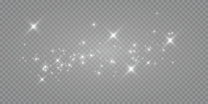 The dust sparks and golden stars shine with special light. Vector sparkles on a transparent background. Christmas lights