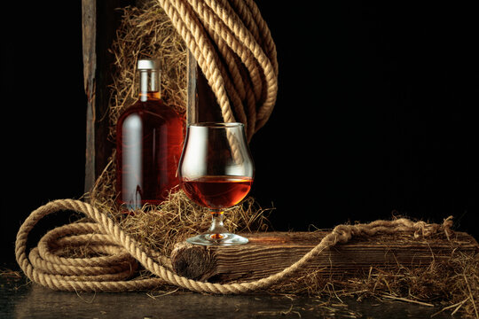 Bottle of and glass of whiskey.