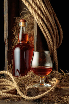 Bottle of and glass of whiskey.