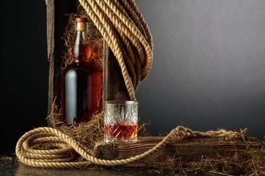 Bottle of and glass of whiskey.