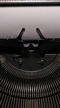 Vertical Macro Shot of Vintage Typewriter Typing the Words To Do List