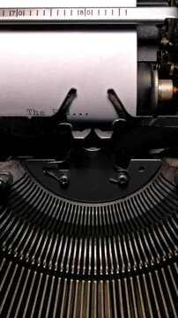 Vertical Macro Shot of Vintage Typewriter Typing the Words The End