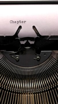 Vertical Macro Shot of Vintage Typewriter Typing the Word Chapter