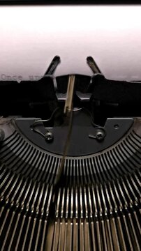 Vertical Macro Shot of Vintage Typewriter Typing the Words Once Upon a Time
