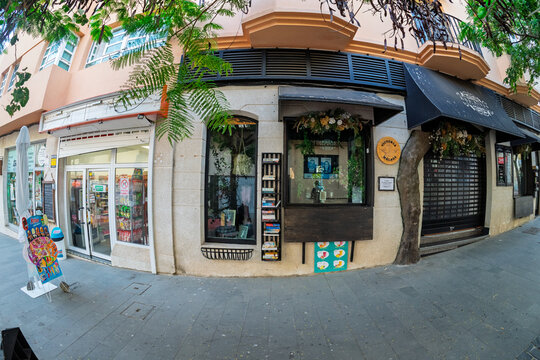 MORRO JABLE, FUERTEVENTURA &ndash; JULY 31, 2026: Small shops and a corner storefront on an old town street, shot with a fisheye lens.