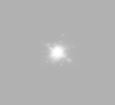 A bright white light burst radiates from the center against a black background. Sharp rays extend outward in a star-like pattern with scattered soft glows.