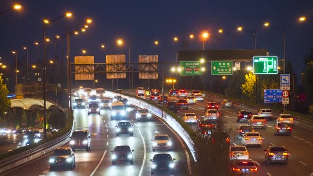 Night Traffic on Busy Urban Highway in Beijing with Illuminated Streetlights in Beijing, China