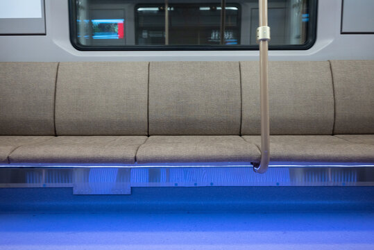 Interior of the modern subway carriage with empty seats