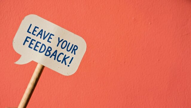 Leave your feedback speech bubble sign on red background representing customer review request and business survey engagement concept