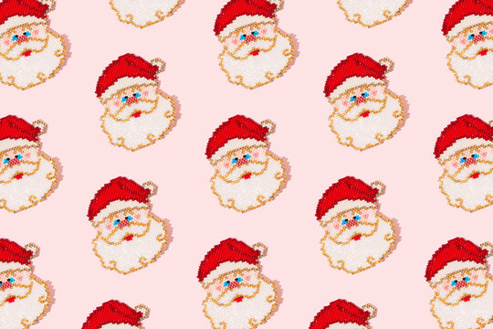 Santa Claus with white beard and red hat on a pink background. Happy Christmas, santa pattern