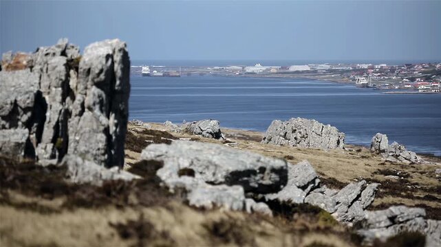 Panning Shot From Rocks Revealing Port Stanley (Puerto Argentino) In Falkland Islands (Malvinas) - 4K