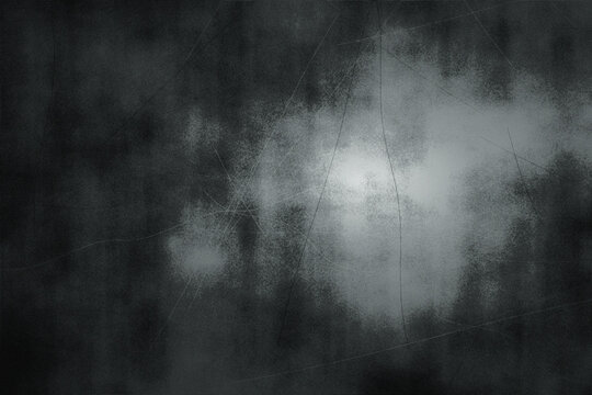 Abstract dark monochrome grunge textured surface background with light scratches and dust for design elements or overlay effects.
