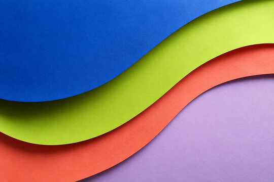 Layered cobalt lime coral and lavender paper waves abstract background
