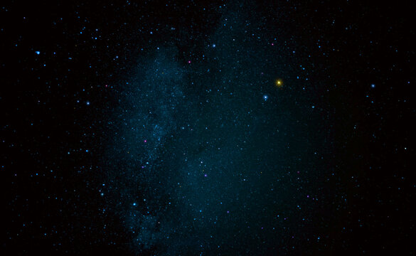 Night sky with shining stars and a galaxy in space.