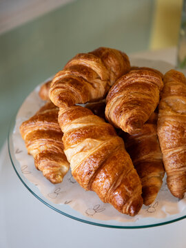 plate full of fresh croissants
