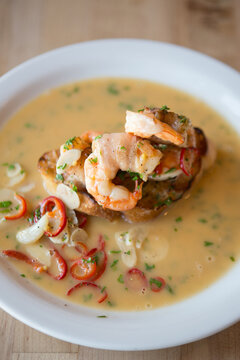 Crostini with white shrimp, garlic, chile and pancetta.