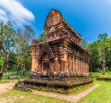A view of a red brick Hindu tower at the My Sơn Sanctuary in Quang Nam Province, Vietnam on a bright sunny day