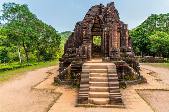 A view up steps into a Hindu temple ruins at the My Sơn Sanctuary in Quang Nam Province, Vietnam on a bright sunny day