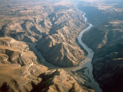 Aerial View of Rugged Canyon Landscape with Meandering River