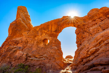Turret Arch frames brilliant sunburst in Arches National Park © PhotoSpirit