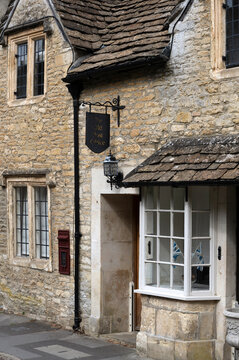 CASTLE COMBE, WILTSHIRE - AUGUST 08, 2026:  Architectural detail of pretty cotswold stone cottage