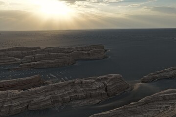 Yadan National Geopark near Dunhuang, Gansu, China, features dramatic wind-eroded rock formations rising from the Gobi Desert. A striking landscape along the ancient Silk Road. © JEREMIE