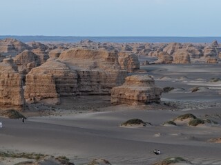 Yadan National Geopark near Dunhuang, Gansu, China, features dramatic wind-eroded rock formations rising from the Gobi Desert. A striking landscape along the ancient Silk Road. © JEREMIE