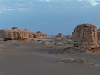 Yadan National Geopark near Dunhuang, Gansu, China, features dramatic wind-eroded rock formations rising from the Gobi Desert. A striking landscape along the ancient Silk Road. © JEREMIE
