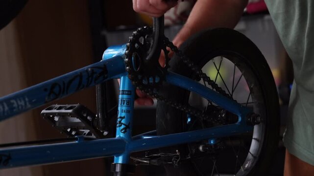 Tightening pedals on kids bike with 15mm box wrench as cassette wheel ticks