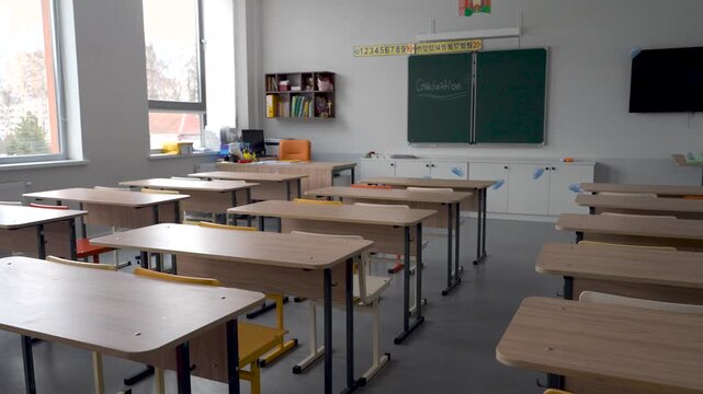 Empty School Classroom Interior With Wooden Desks And Blackboard
