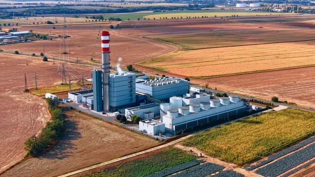 Distancing from a centralized manufacturing plant characterized by specialized cooling towers, warehouses and smokestacks.