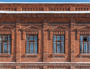 Four windows of the old mansion 19 century with brown bricks wall © Dmitrii Potashkin