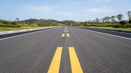 Obraz premium Empty asphalt road with double dashed yellow lines in the center