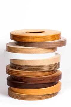 Stack of Wood Grain Edge Banding Rolls for Furniture Manufacturing