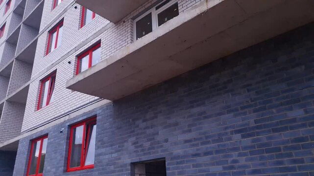 Construction of a brick apartment building. Construction of a residential building or urban structure on a construction site. Installation, real estate construction by a developer, and work performed 