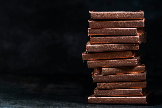 Copper, valuable industrial raw material and globally traded non ferrous metal. Stack of copper bars highlights material value, industrial supply, commodity tradem and the importance of copper in inte