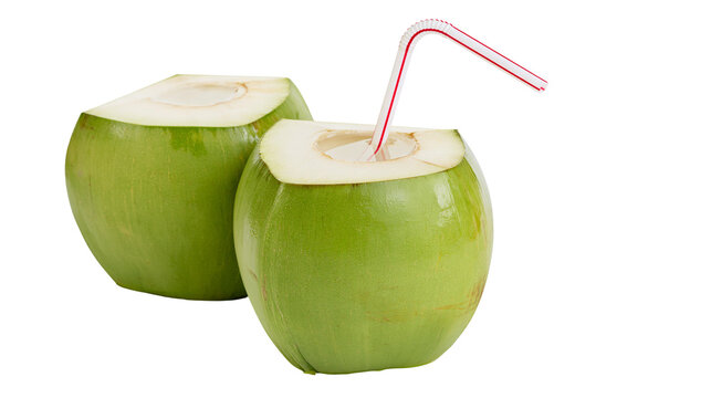 Isolated fresh young green coconuts with striped drinking straw, healthy tropical beverage