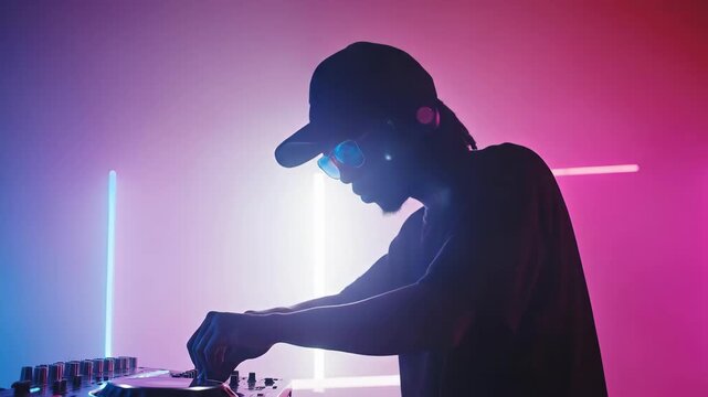 Young african man dj performing in neon lights