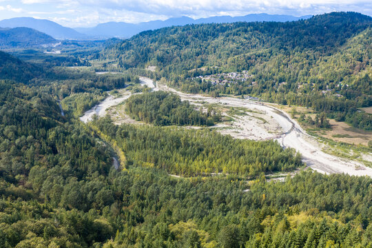 Aerial View Of Winding River Valley Surrounded By Forested Hills Near Chilliwack BC Canada