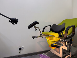gynecological examination chair in clinic room clean wall banner space concept of women health