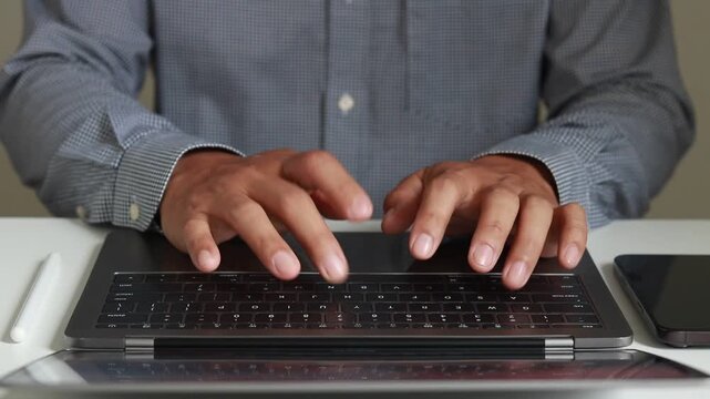 Businessman typing on laptop keyboard with data management. Front view close-up of writing male hands with futuristic document workflow, programming, coding, safety, working online technology concept.