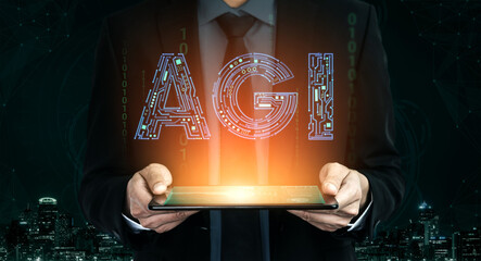 Business Professional Holding Tablet with AGI Concept in Futuristic City Background, Symbolizing...