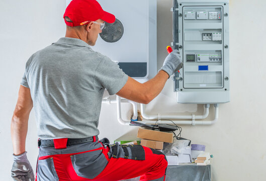 Electrician inspecting a distribution board