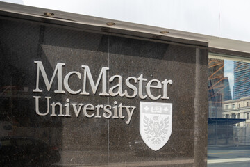 Obraz premium Toronto, Ontario, Canada - September 16, 2026: A exterior signage on the building at McMaster University's Toronto Campus on Bloor Street West in Toronto, Ontario, Canada. 