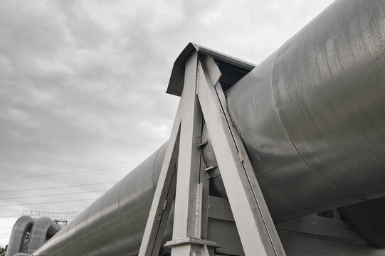 close-up of a pipeline against a gray sky