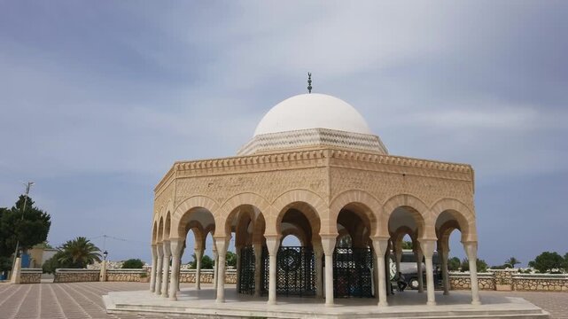 Historical monument with archways and dome of Thombs Martyrs in Monastir, Tunisia under clear sky