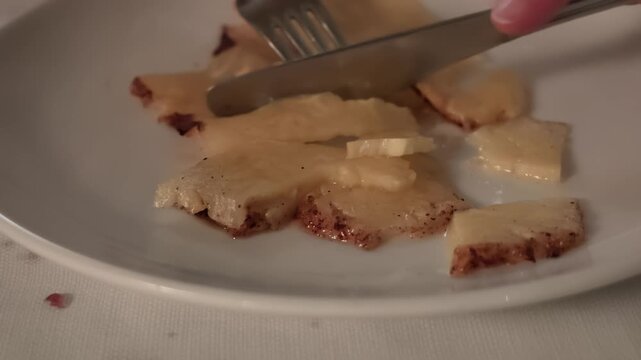 sliced cinnamon pineapple on traditional sword at Brazilian churrascaria, hot grilled tropical fruit, Brazilian barbecue dessert. Refined dining, romantic evening, special occasion, luxury lifestyle.